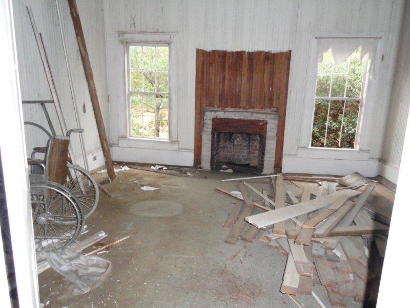 Two of the three original bedrooms are graced with four huge windows and a fireplace.