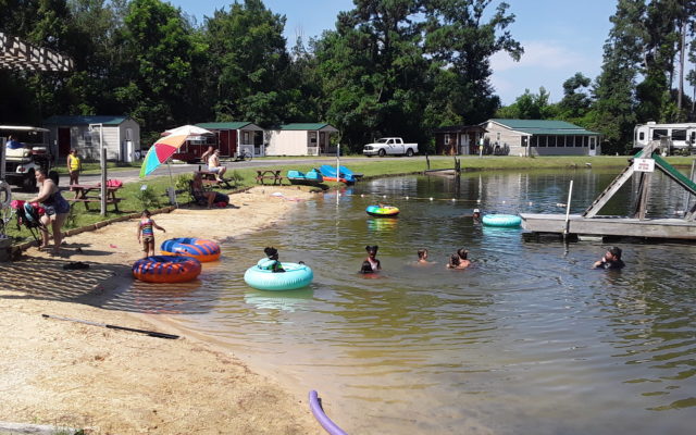 Beaver Run Lake with kids in the lake on rafts