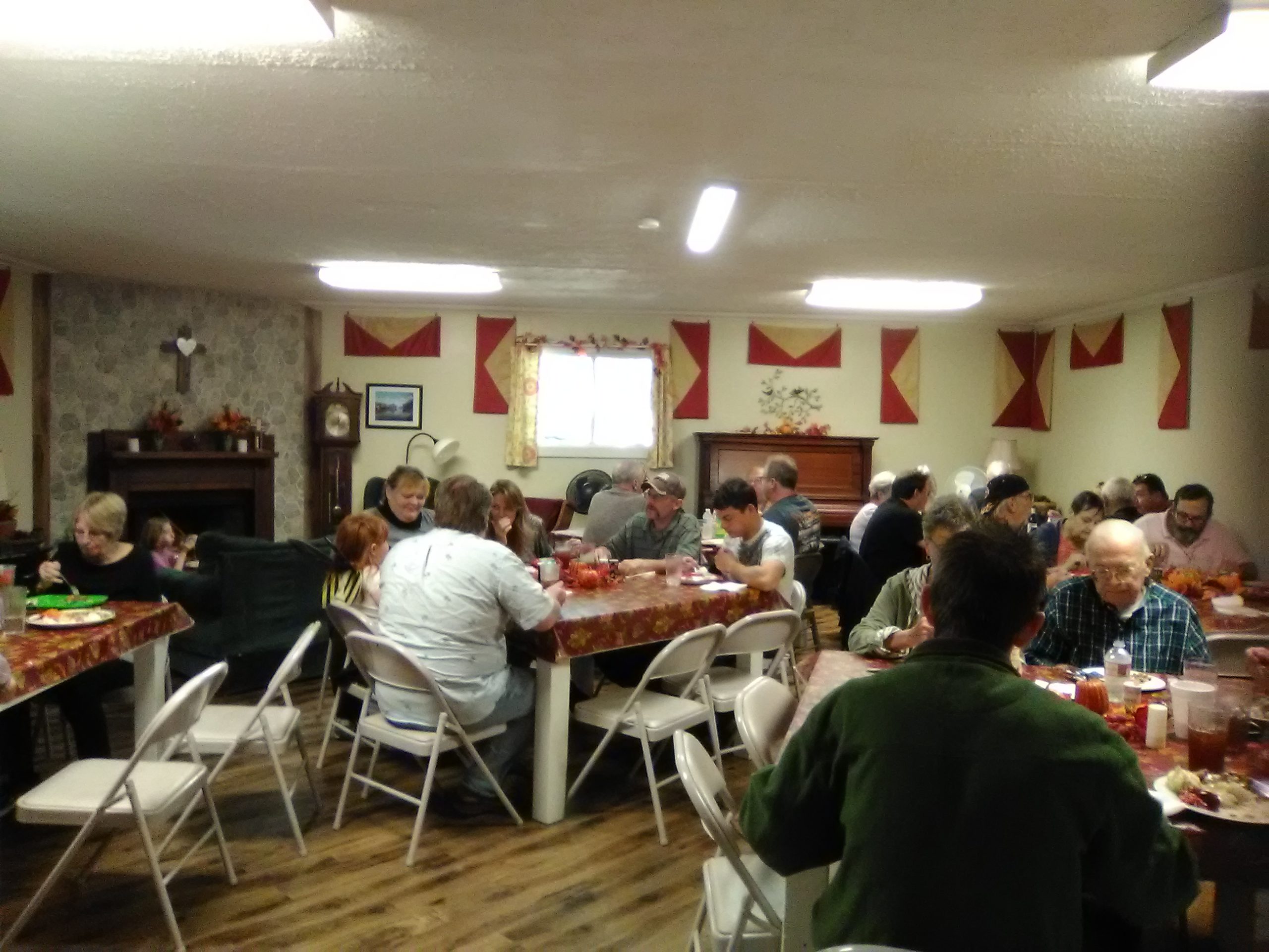 People inside large room eating dinner at Beaver Run RV Park